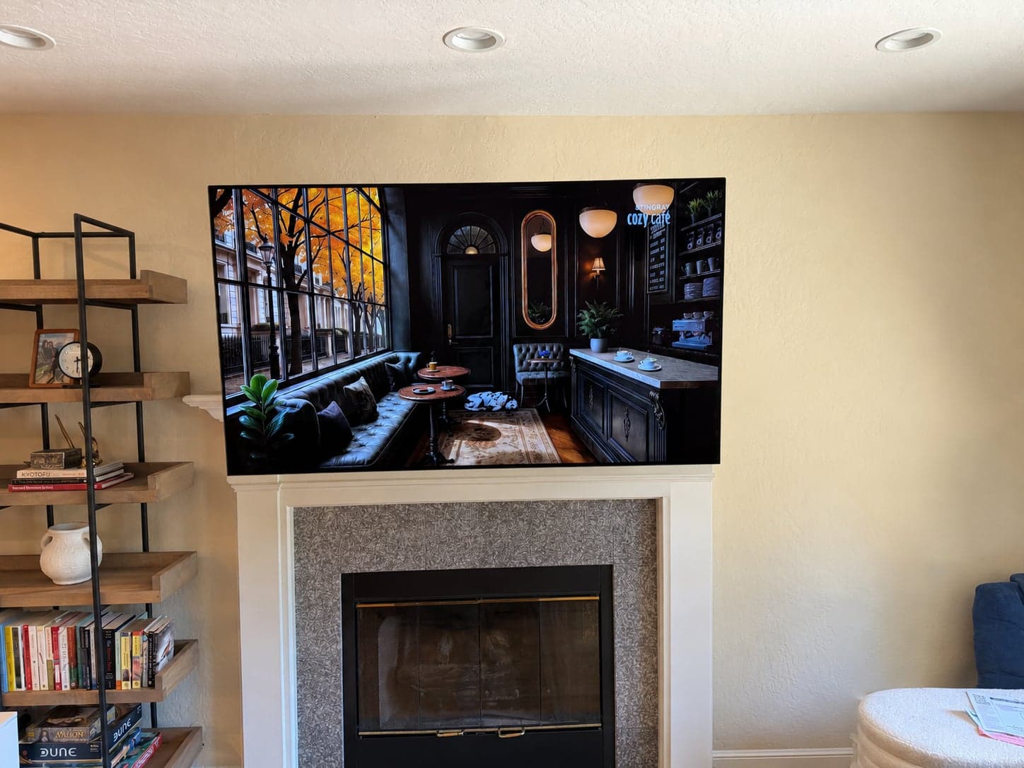 A flat screen TV mounted above a tiled fireplace mantel