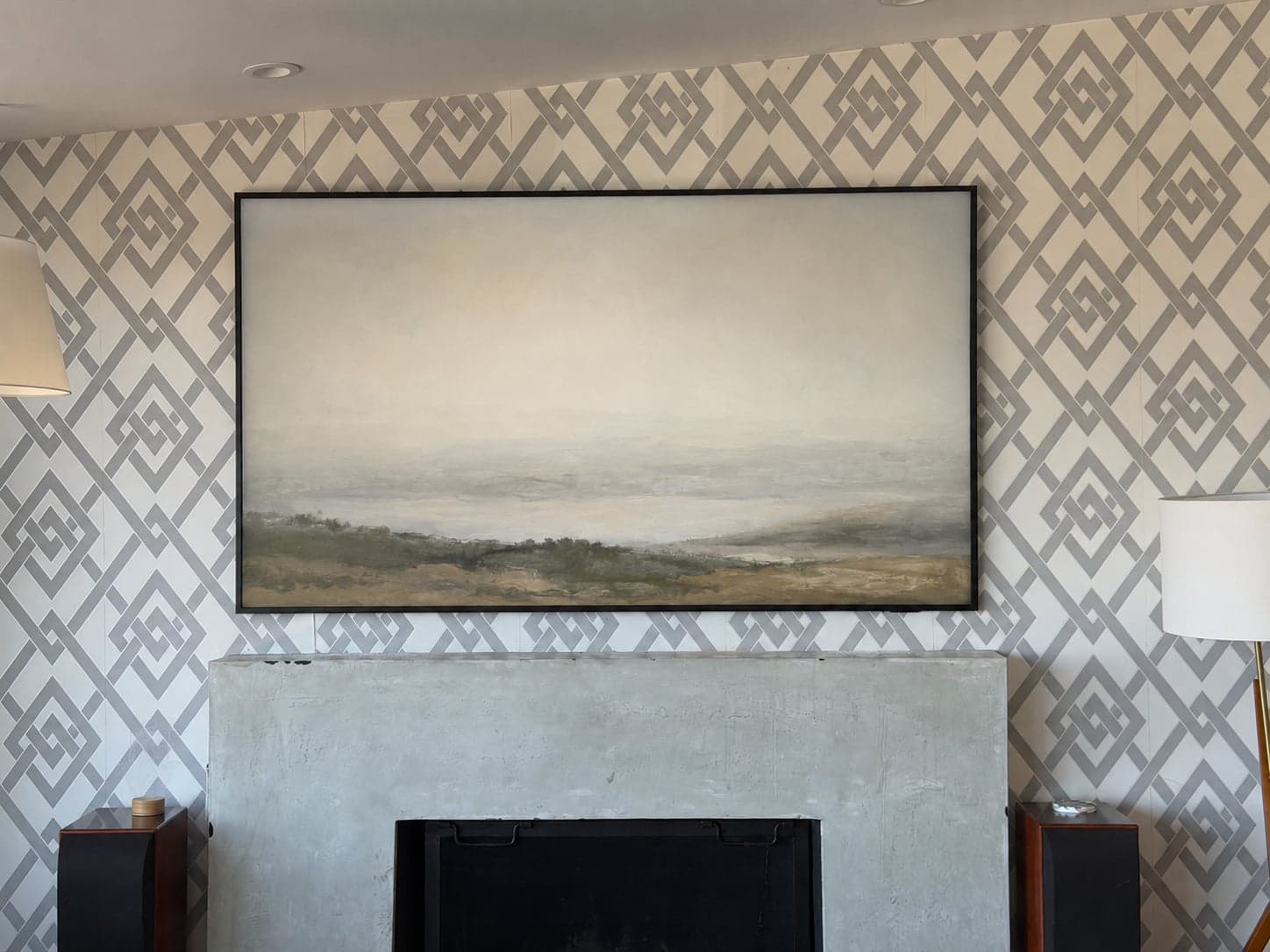 A Samsung Frame TV in art mode, fitted flush against a wallpapered wall